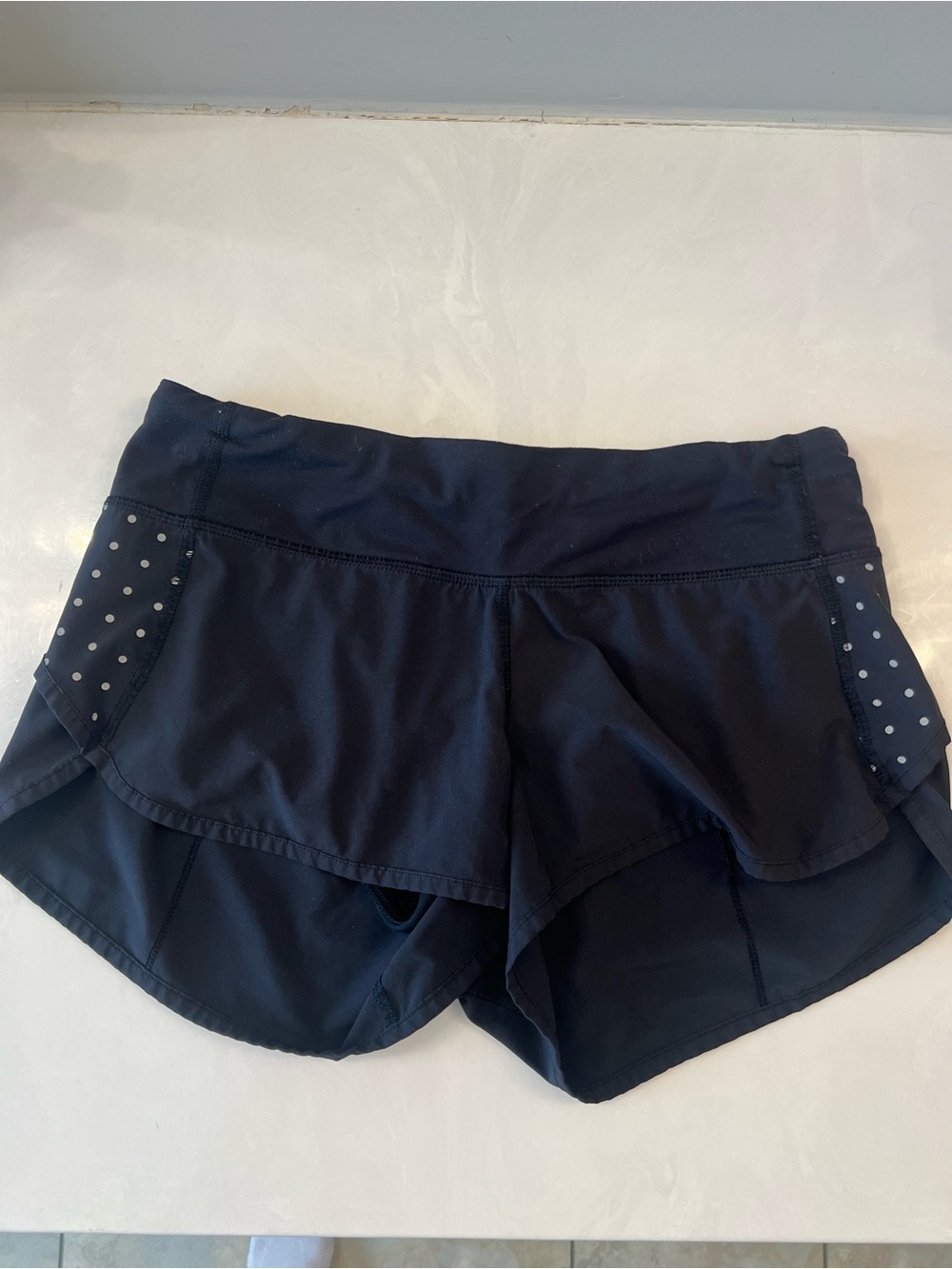 lululemon black layered running shorts with dotted side panels
